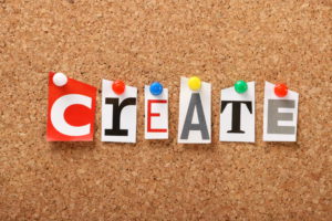 The word Create on a cork board